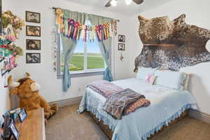 Bedroom featuring carpet floors and a ceiling fan