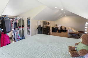 Loft featuring recessed lighting, vaulted ceiling, and dark carpet