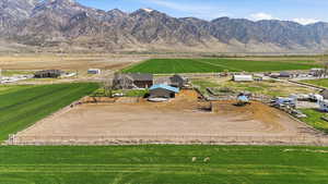 Aerial view of sparsely populated area featuring mountains and farmland