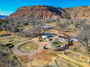 Aerial view of sparsely populated area with a mountain backdrop