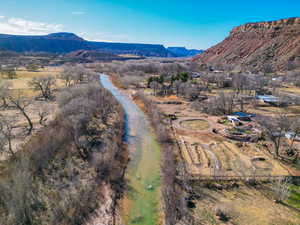 Aerial view of sparsely populated area with a water and mountain view