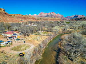 View of rural area featuring a water and mountain view and a tree filled landscape