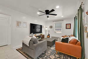 Tiled living area featuring recessed lighting and a ceiling fan