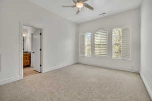 Spare room with light carpet and ceiling fan