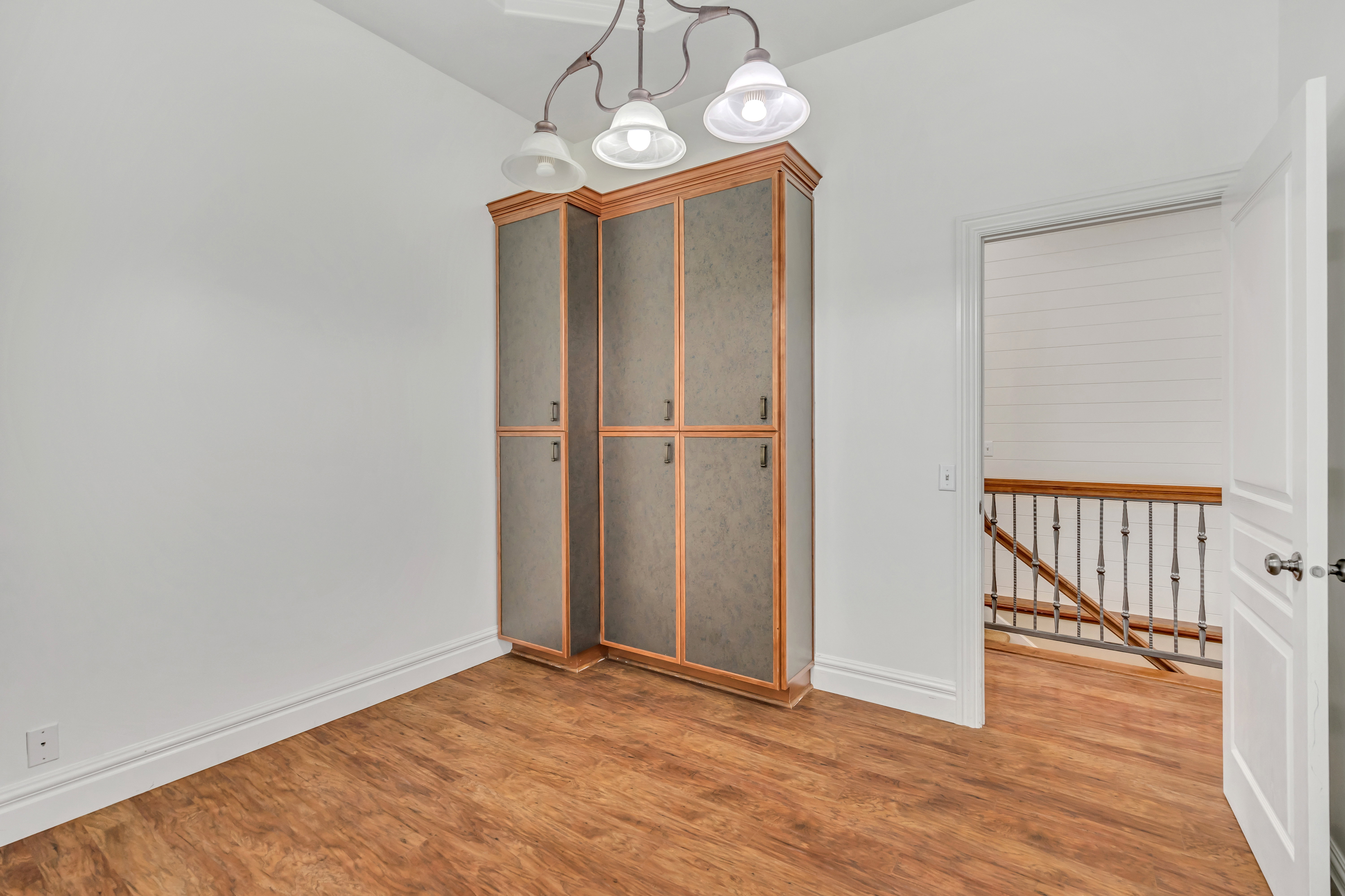 Unfurnished dining area with light wood-style floors and baseboards