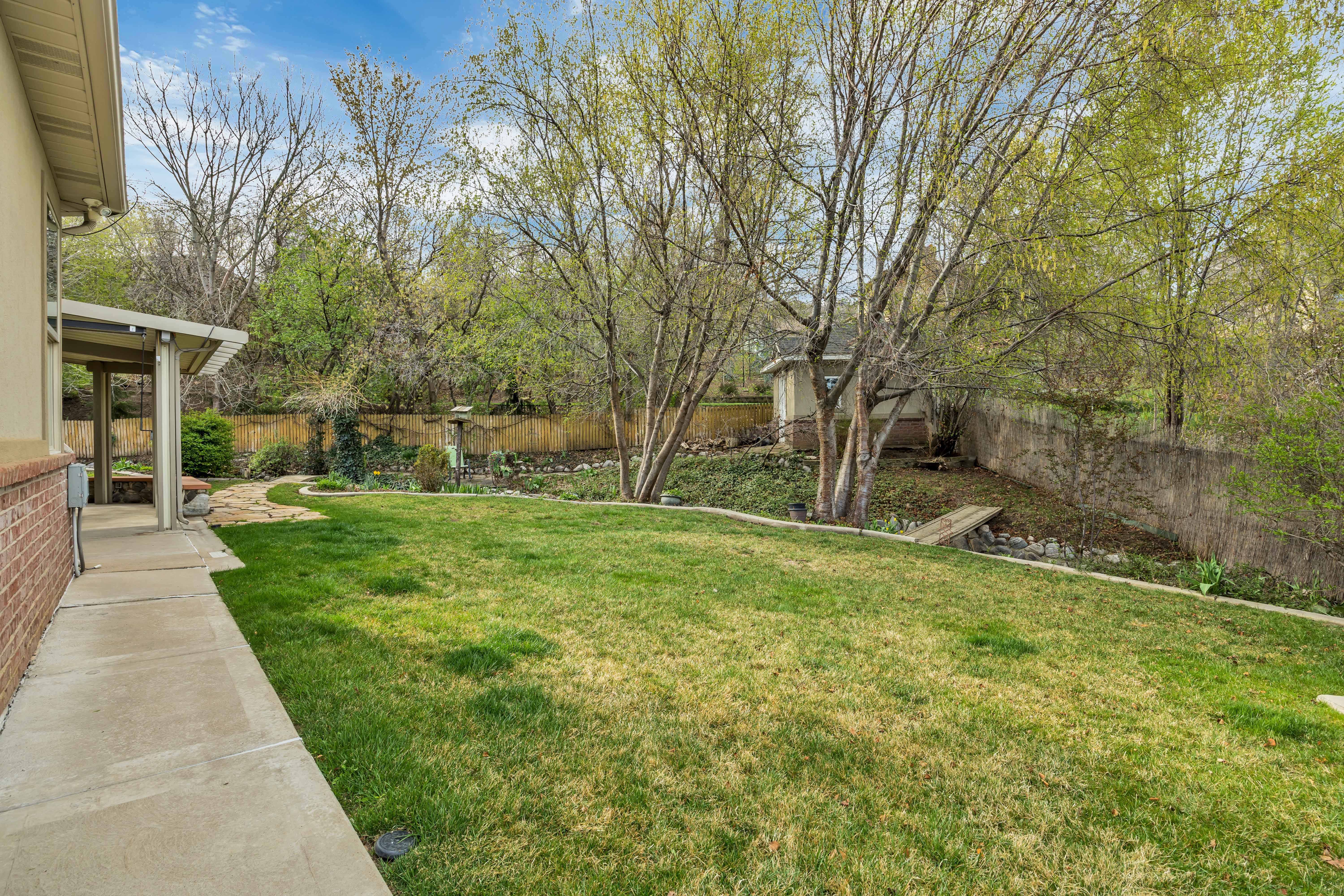 Fenced backyard featuring a patio
