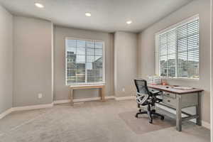Office area featuring recessed lighting and light carpet