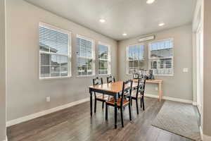 Dining area featuring hardwood / wood-style floors, plenty of natural light, recessed lighting, and a textured ceiling
