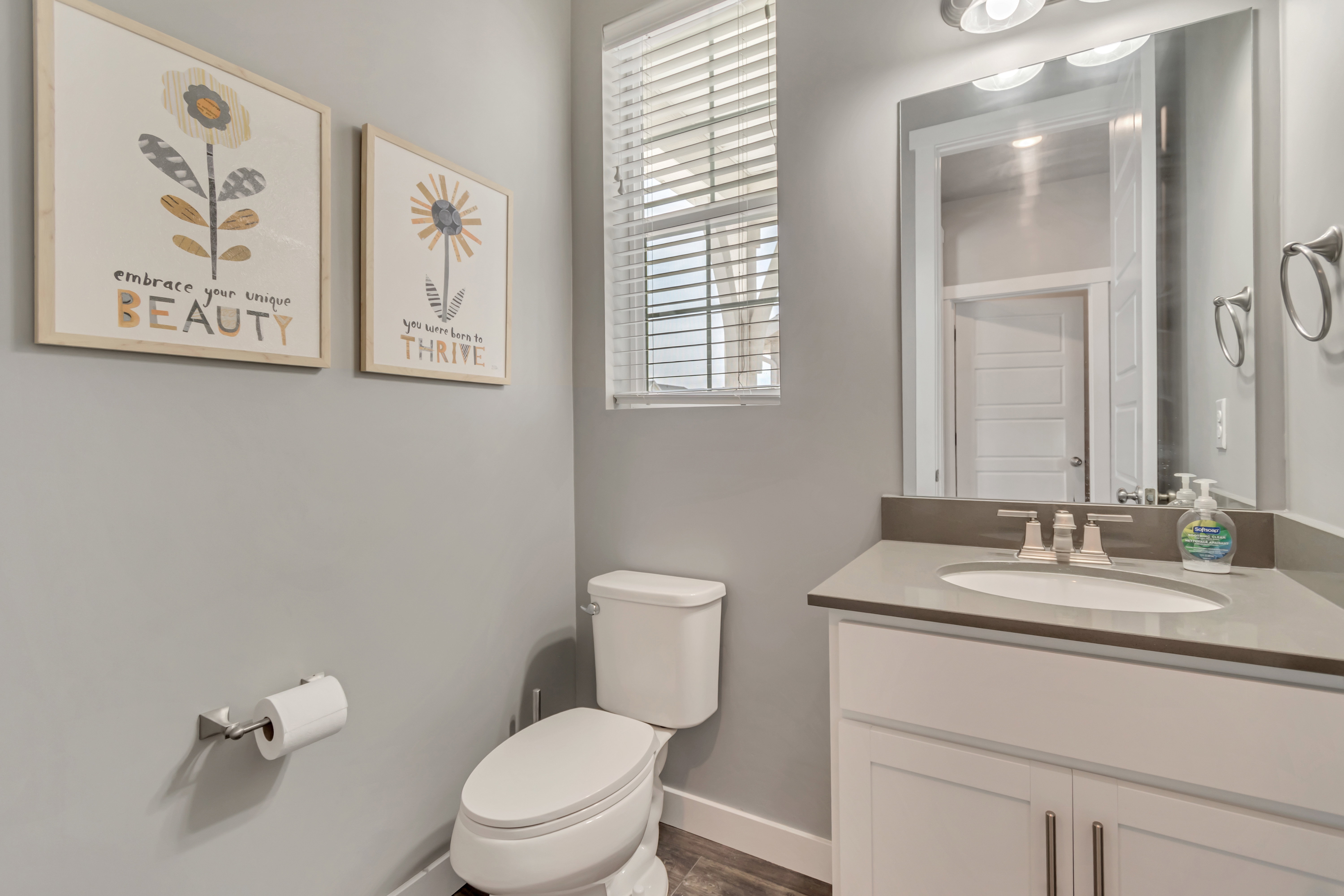 Bathroom featuring vanity and dark wood finished floors