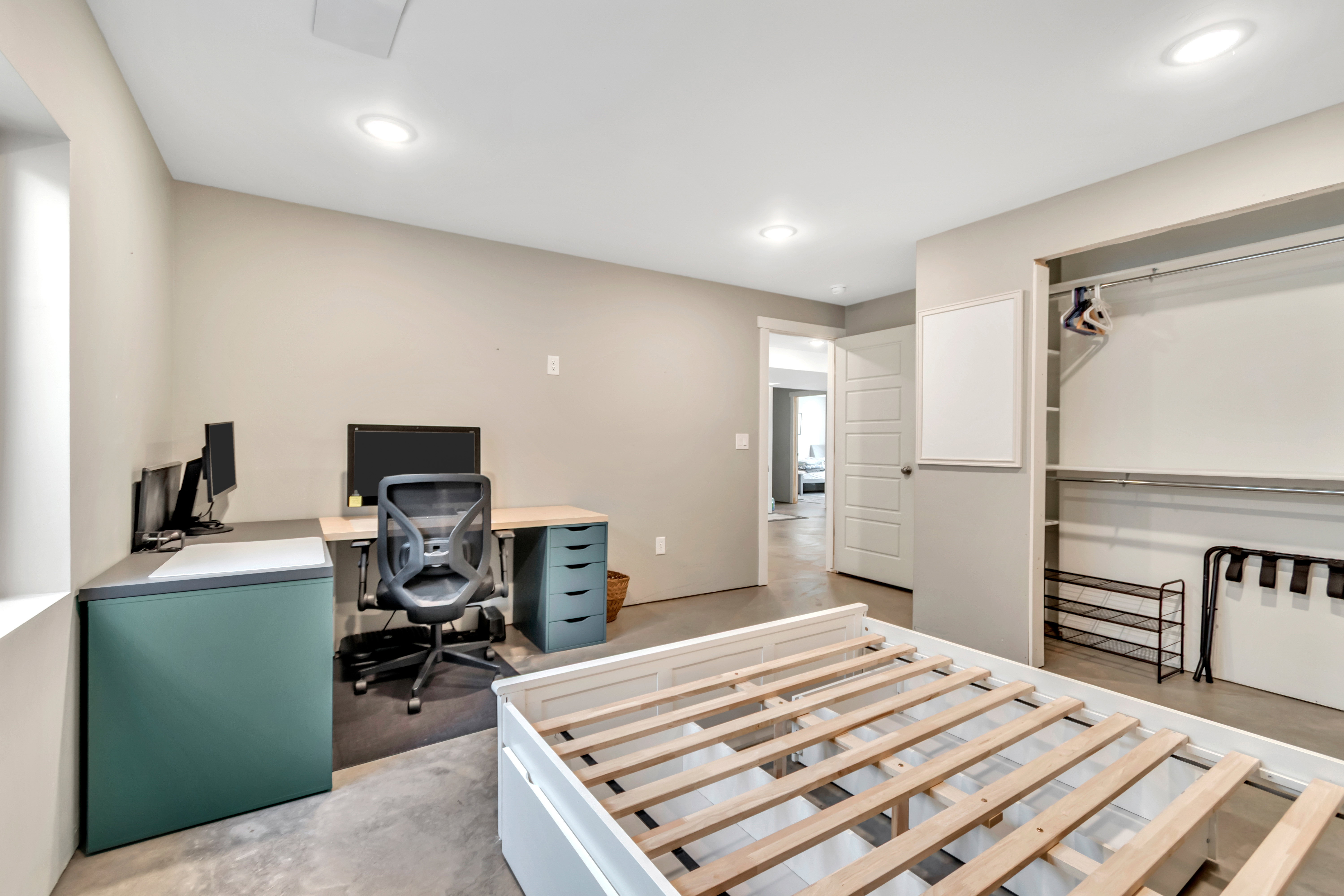 Bedroom with a desk and recessed lighting