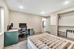 Bedroom with a desk and recessed lighting