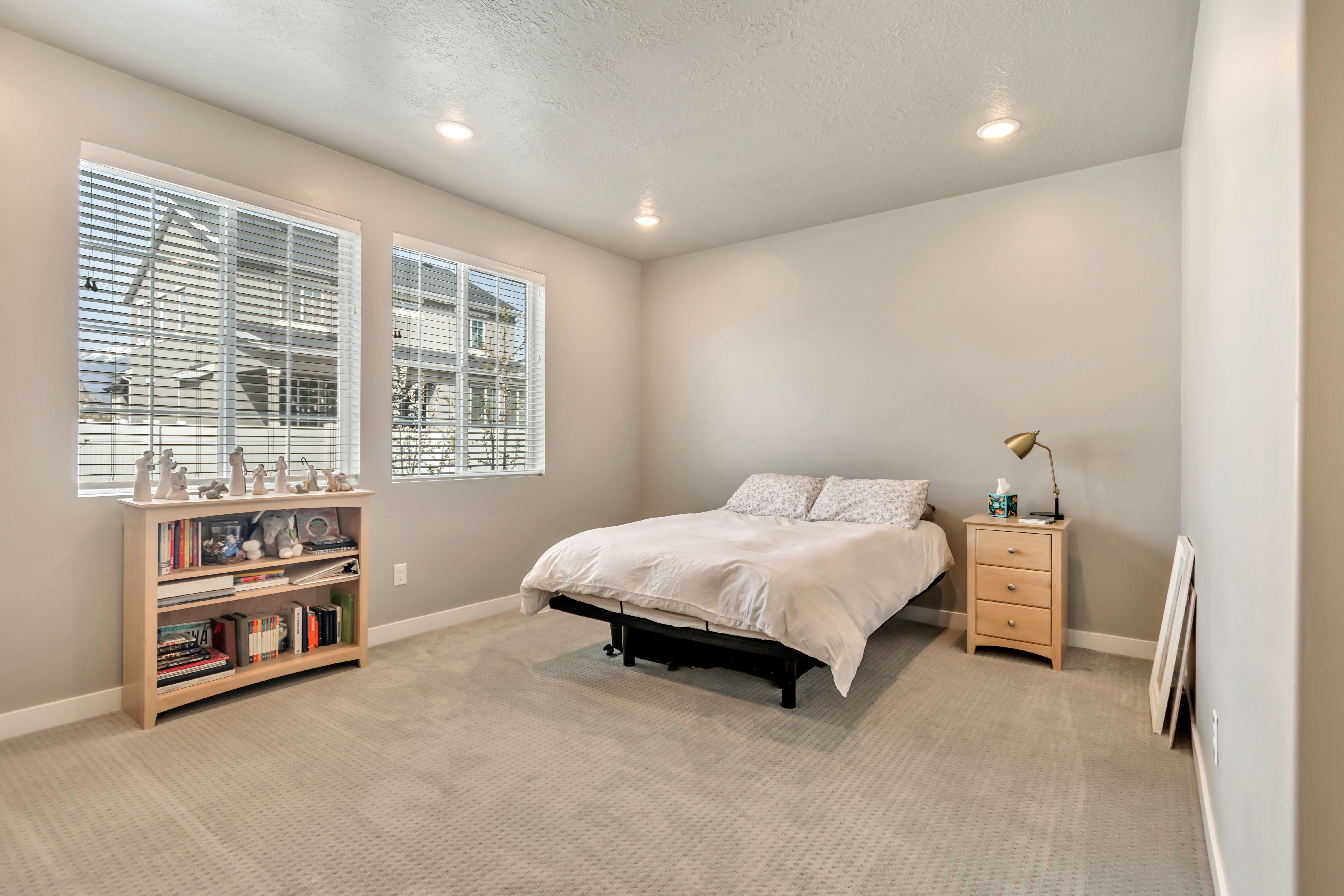 Bedroom featuring recessed lighting, light colored carpet, and a textured ceiling