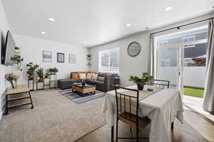 Dining space with recessed lighting and wood finished floors