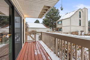 View of snow covered back of property