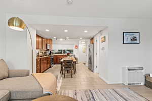 Dining room featuring recessed lighting and heating unit