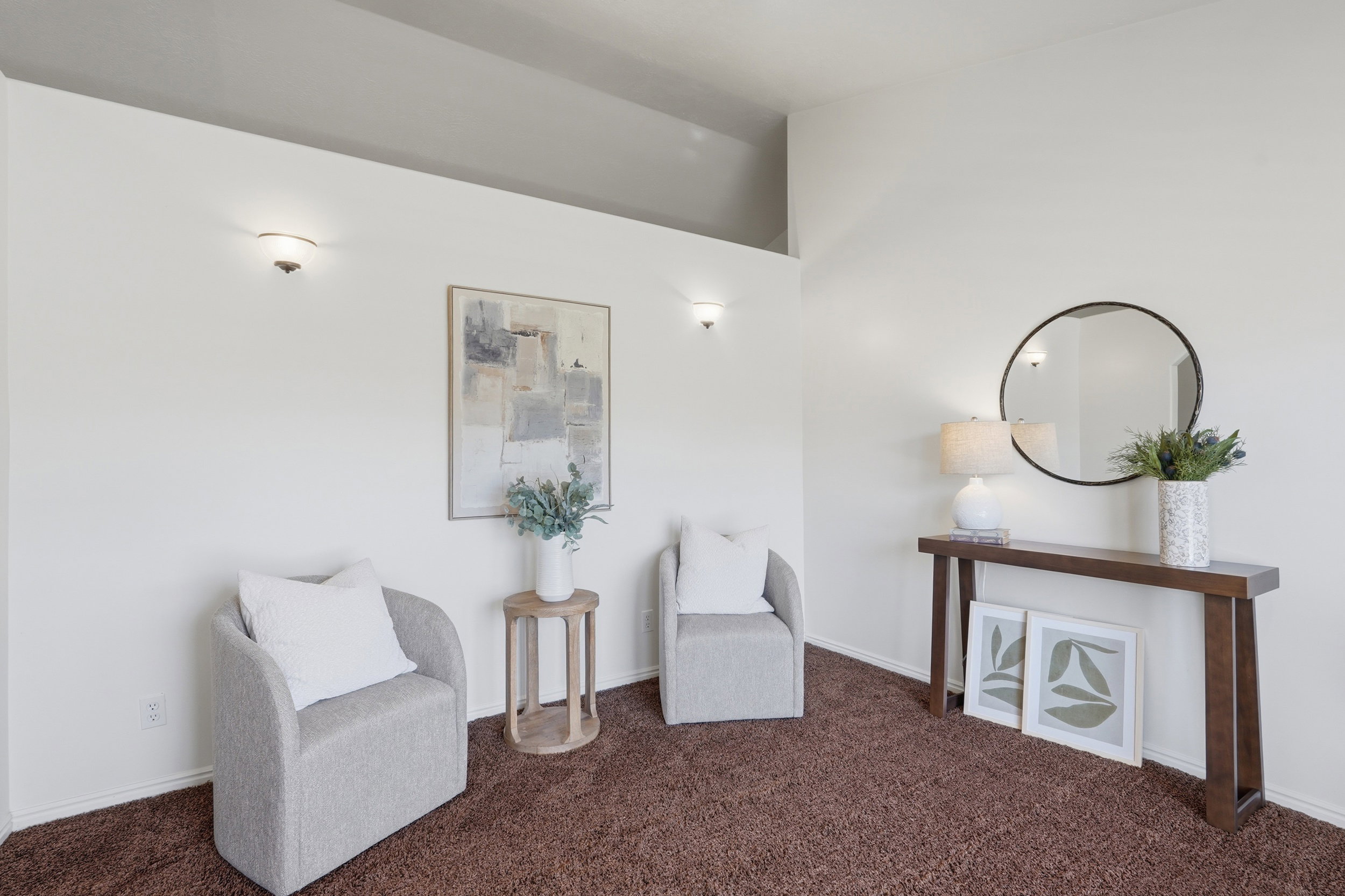 Living area with carpet and baseboards