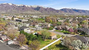 Aerial view of residential area featuring a mountain backdrop