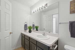 Bathroom featuring vanity and toilet