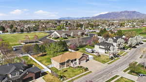 Aerial perspective of suburban area with a mountain backdrop