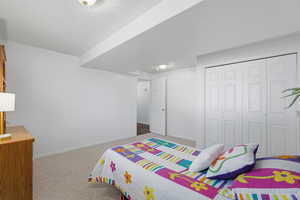 Carpeted bedroom with baseboards