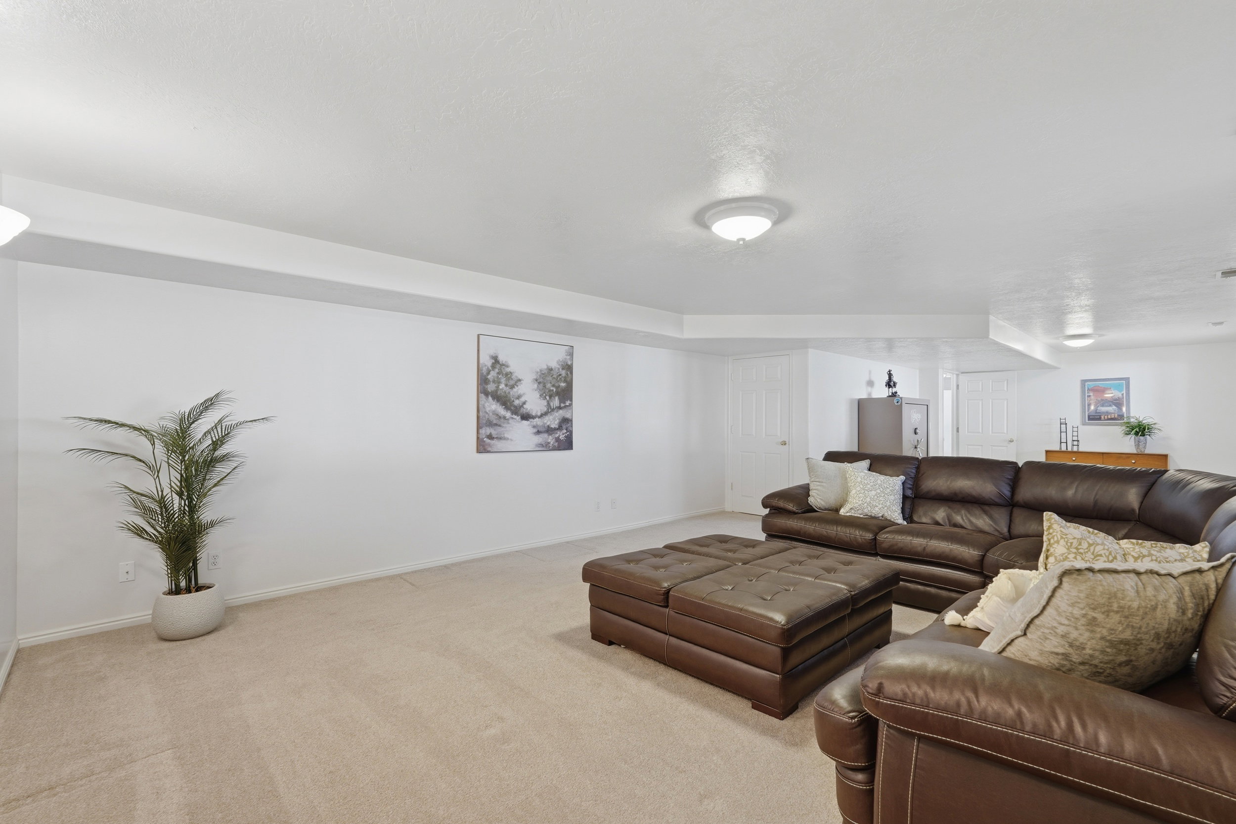 Living room with baseboards and carpet floors