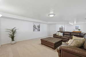 Living room with baseboards and carpet floors