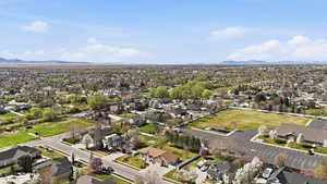 Aerial view of residential area featuring a mountain backdrop