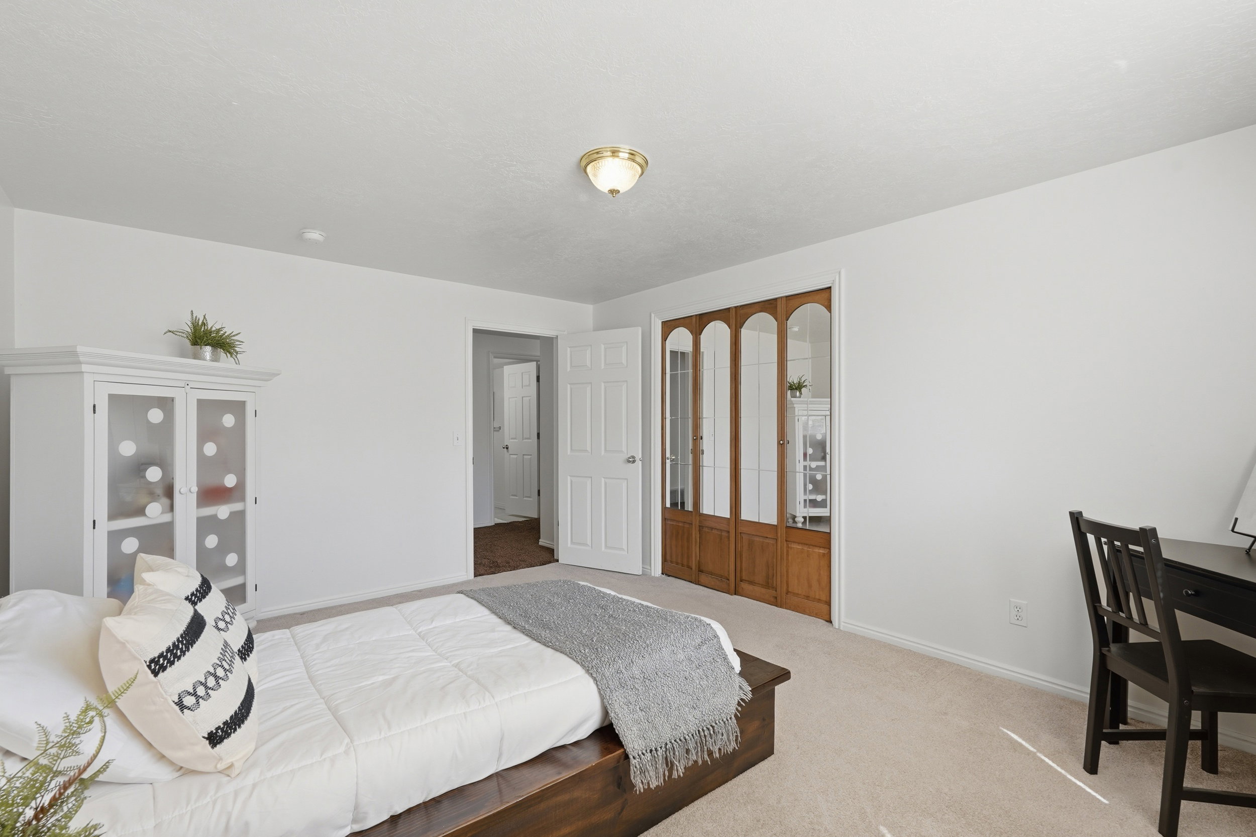 Carpeted bedroom with baseboards
