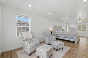 Bedroom with light wood-style flooring, recessed lighting, and a ceiling fan