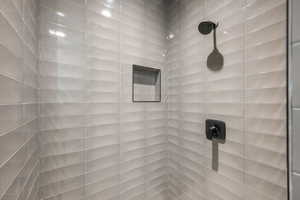 Bathroom view of a tile shower