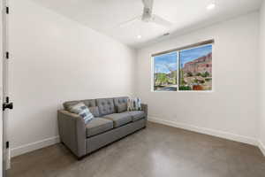Living area with recessed lighting and a ceiling fan