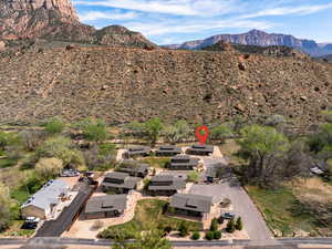 Aerial view of residential area featuring a mountainous background