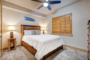 Bedroom with carpet flooring and ceiling fan