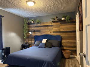 Bedroom featuring wood finished floors