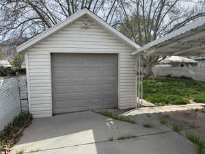 Detached garage with concrete driveway