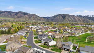 Aerial view of residential area featuring mountains