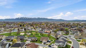 Aerial perspective of suburban area with a mountainous background