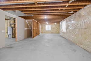 Basement with strapped water heater