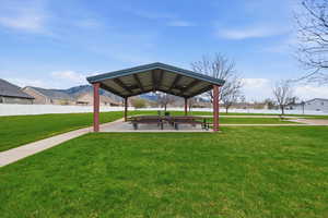 View of property's community with a residential view, a patio area, and a mountain view