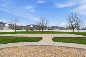 View of property's community with a mountain view, community basketball court, and a residential view