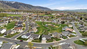 Aerial view of residential area featuring a mountain backdrop