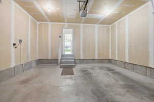 Garage featuring a garage door opener