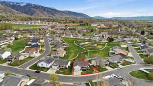 Aerial view of residential area featuring a mountainous background