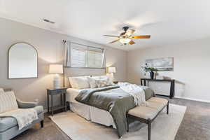 Bedroom with carpet and a ceiling fan