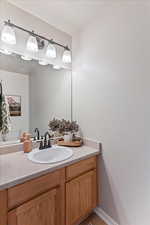 Bathroom with vanity and toilet