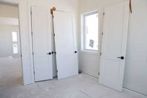 Unfurnished bedroom featuring baseboards