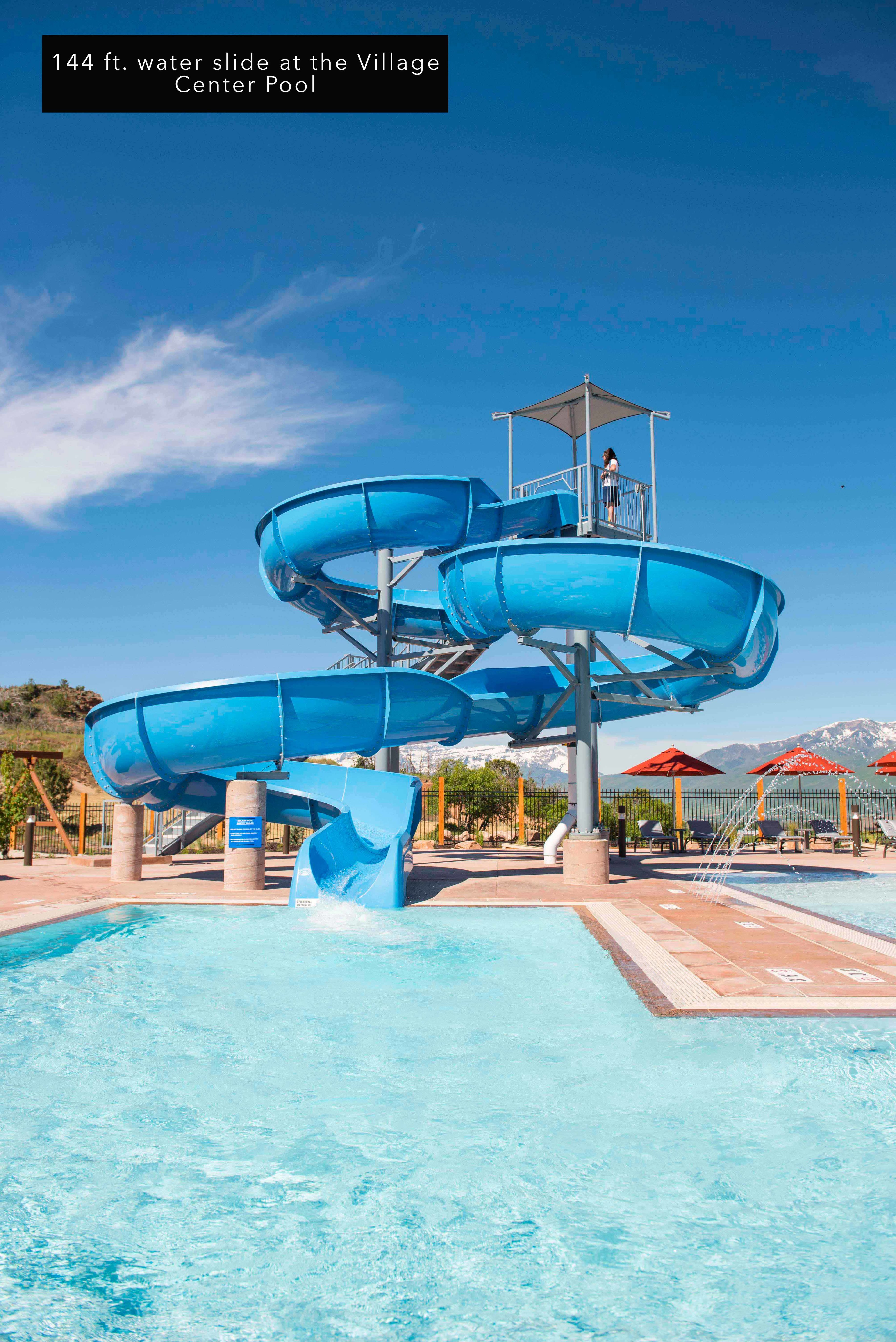 Swimming pool featuring a water slide and a mountain view