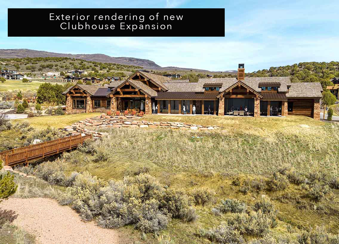 Rear view of property with stone siding, a mountain view, a patio area, and a chimney