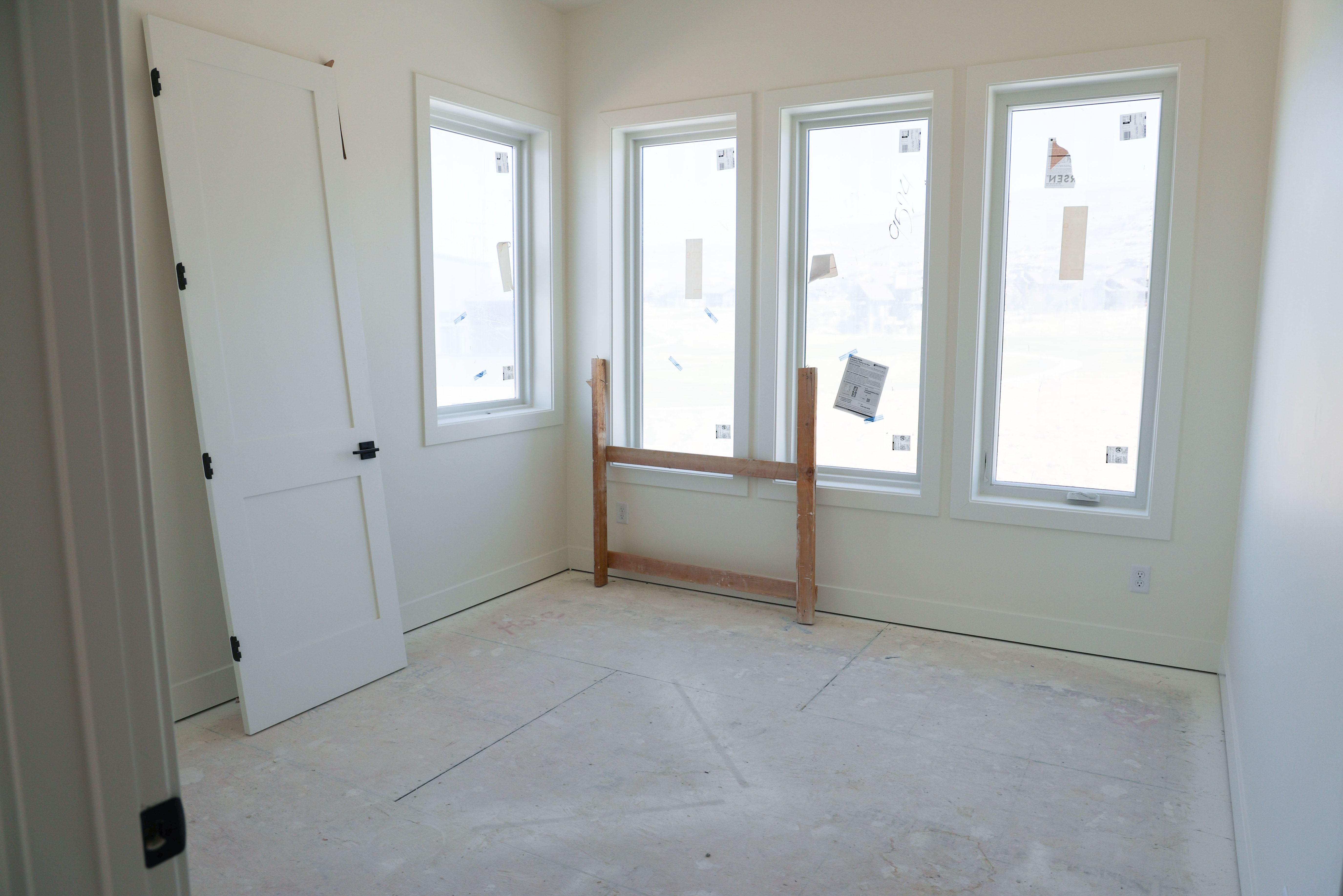 Unfurnished room with baseboards
