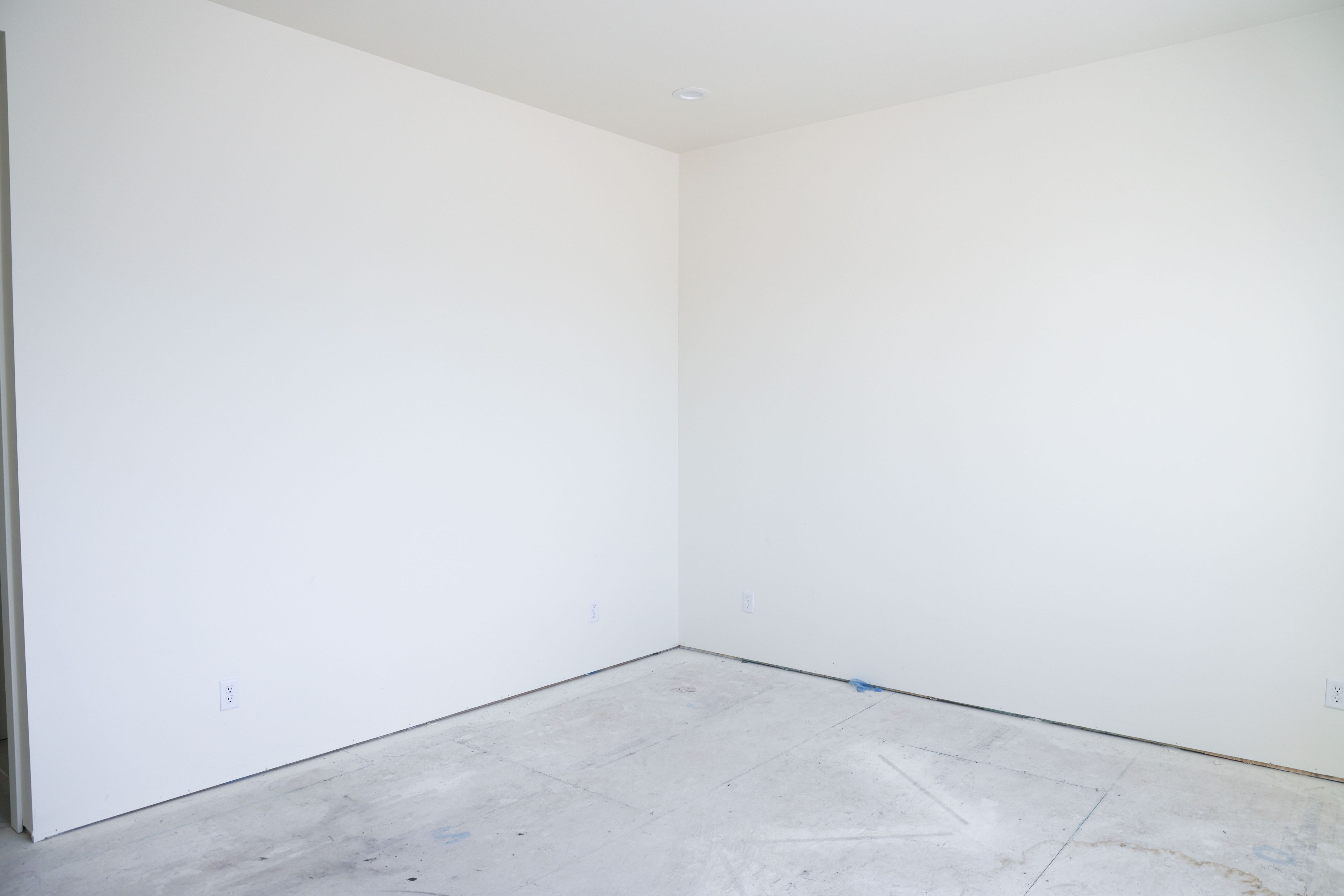 Unfurnished room featuring concrete flooring